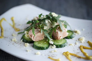 Salad with canned tuna, boiled egg and fresh cucumber.