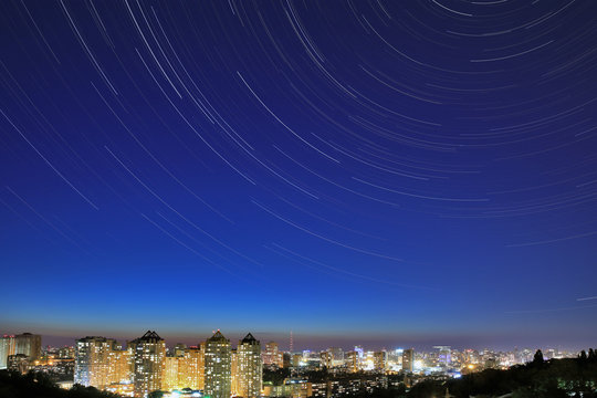 Star tracks over night Kiev cityscape