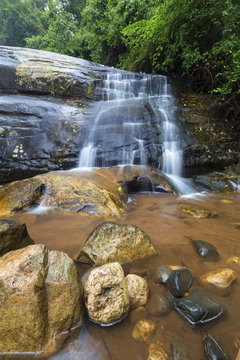 River flowing over rocks and the Debengeni Waterfall