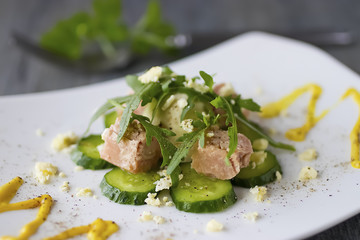 Salad with canned tuna, boiled egg and fresh cucumber.