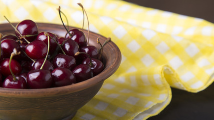 Fresh cherries in plate  with copy space. Summer and harvest concept.