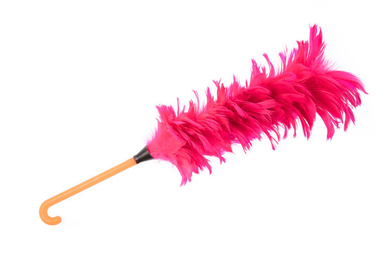 Pink duster feather broom isolated on white background.
