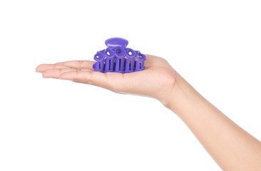 hand holding plastic hair clip isolated on white background