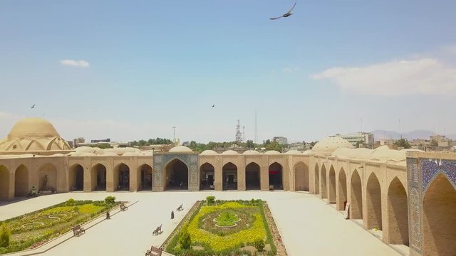 Aerial panoramic drone view of traditional houses, roofs, mosque and area. Iran, Kerman may 2018