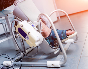 Patient on CPM (continuous passive range of motion) machines. Device to provide anatomically correct motion to both the ankle and subtalar joints.
