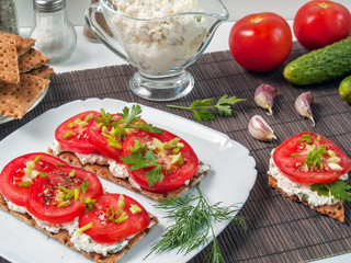 Buckwheat crisp bread with cheese cheese, tomato, herbs, spices