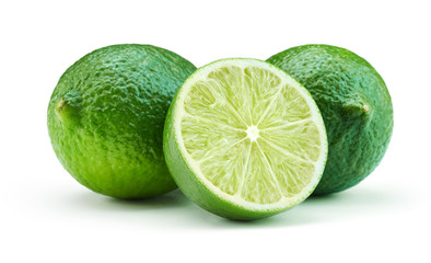 whole and cut lime fruits isolated on white background
