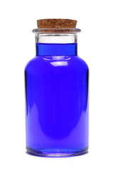Old blue glass bottles isolated on white