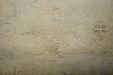  texture of an ancient inscription on the wall