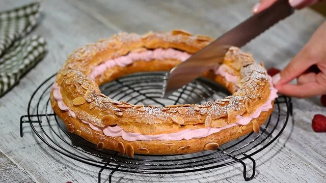Homemade choux pastry cake Paris Brest with raspberries. French dessert.