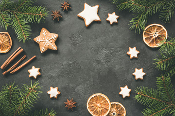 Christmas or New Year 2019 Frame Background. Gingerbread cookies, spices, fir tree and cinnamon on concrete background. Copy space for text - obrazy, fototapety, plakaty