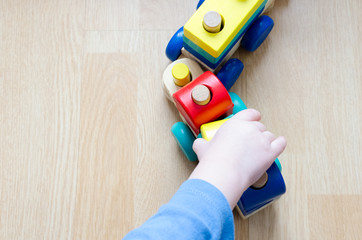 Child's hand with a toy