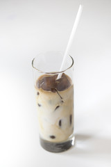 Iced coffee cocktail or frappe with ice cubes and cream
