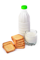 A bottle of milk and glass of milk with crispy toasters. Мorning meals. Isolated on white background.