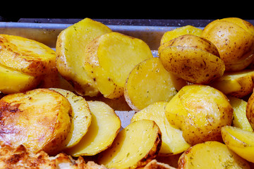 Grill potatoes roasted on home fried potatoes on the grill background