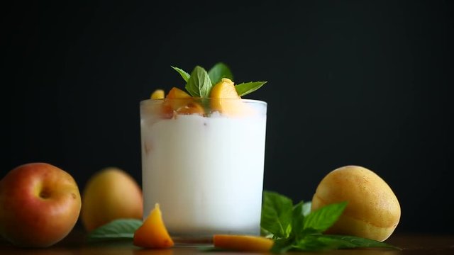 homemade yogurt with ripe apricots