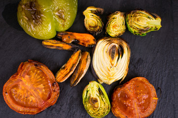 Grilled vegetables on a dark background.