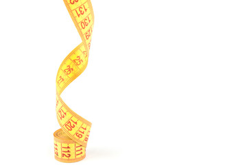 Yellow flexible porn centimeter for measurements on a white background.