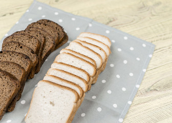 Sliced black and white bread.
