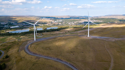 Large wind turbines on a rural hillside in Wales (Tredegar)