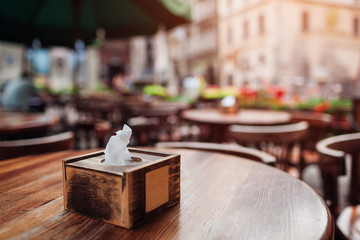Empty cafe. Wooden chairs beside bar counter. Red vintage seats in row