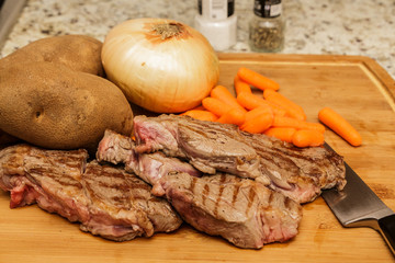 Three Chuck Steaks with Vegetables