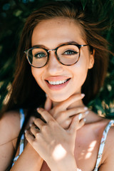 Closeup emotional  lifestyle portrait of adorable beautiful young cheerful coquette fashionable...