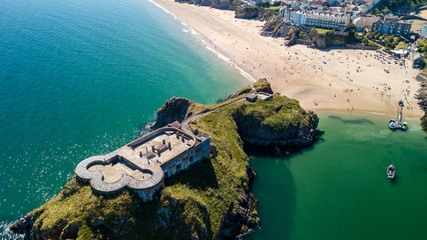 Aerial drone view of an old, historic fort on a small island off a picturesque, colorful coastal...