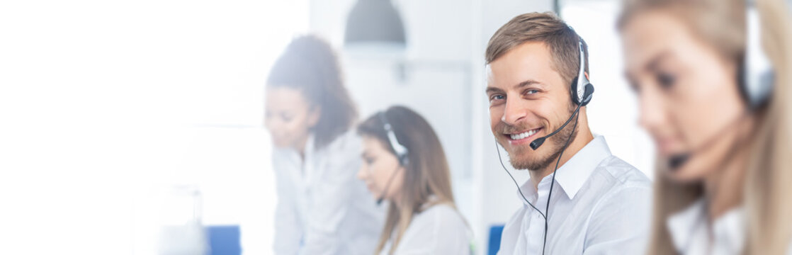 Call center worker accompanied by his team.