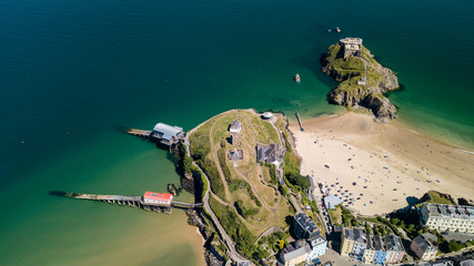 Aerial drone view of beautiful sandy beaches at a colorful, picturesque coastal town