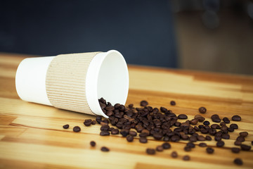 Good Morning. Coffee To Go. Coffee Beans on Wooden Table Backound