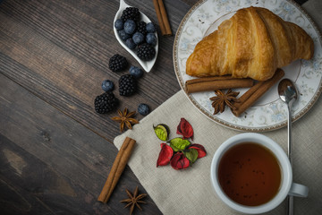 Breakfast with croissants, leaves. Flat lay, top view