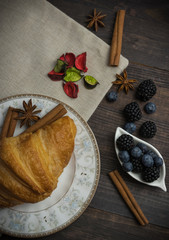 Breakfast with croissants, leaves. Flat lay, top view