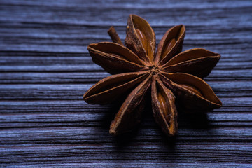 Star anise on blue rustic background