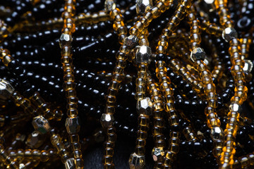 Black texture of beads. macro photo.