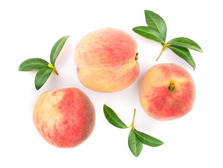 ripe peaches with leaves isolated on white background. Top view. Flat lay pattern