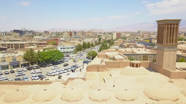 Aerial panoramic drone view of traditional houses, roofs, mosque and area. Iran, Kerman may 2018