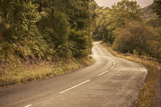 A two lane road in the English countryside. Lake District National Park, Cumbria