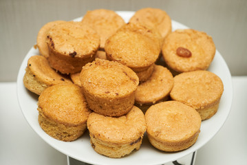 Cookies and sweet biscuits on white plate background, top view 