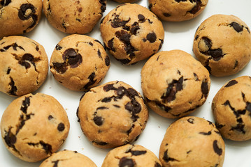 Cookies and sweet biscuits on white plate background, top view 