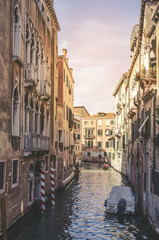 Obraz na płótnie Canvas Traditional narrow canal with gondolas in Venice, Italy
