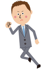 ポップなグレーのスーツの短髪ビジネスマンが走る