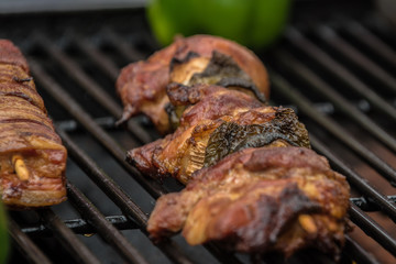 Smoked pork ka-bobs grilling on the barbecue with a tasty aroma.