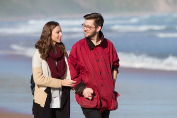 Couple Walking on the Beach in Winter