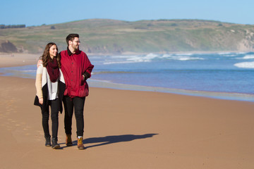 Couple Walking on the Beach in Winter