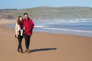 Couple Walking on the Beach in Winter