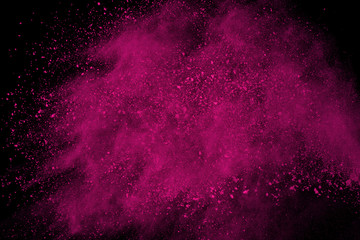 Abstract pink powder explosion on black background. abstract colored powder splatted, Freeze motion...