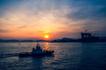 Obraz premium Sunset of Victoria Harbor of Hong Kong