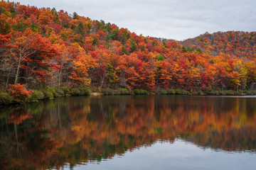 Autumn reflections at Sherando Lake, near the Blue Ridge Parkway in George Washington National Forest, Virginia.