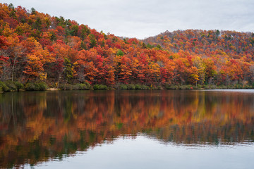 Autumn reflections at Sherando Lake, near the Blue Ridge Parkway in George Washington National Forest, Virginia.